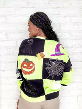 Load image into Gallery viewer, Queen Of Sparkles Green And Black Checkered Icon Sweatshirt with purple sequin witches hat, orange pumpkin, sequin spiderweb and candy corn
