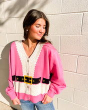 Load image into Gallery viewer, Model wearing Queen of Sparkles pink Santa coat cardigan, button-front V-neck, holiday belt graphic
